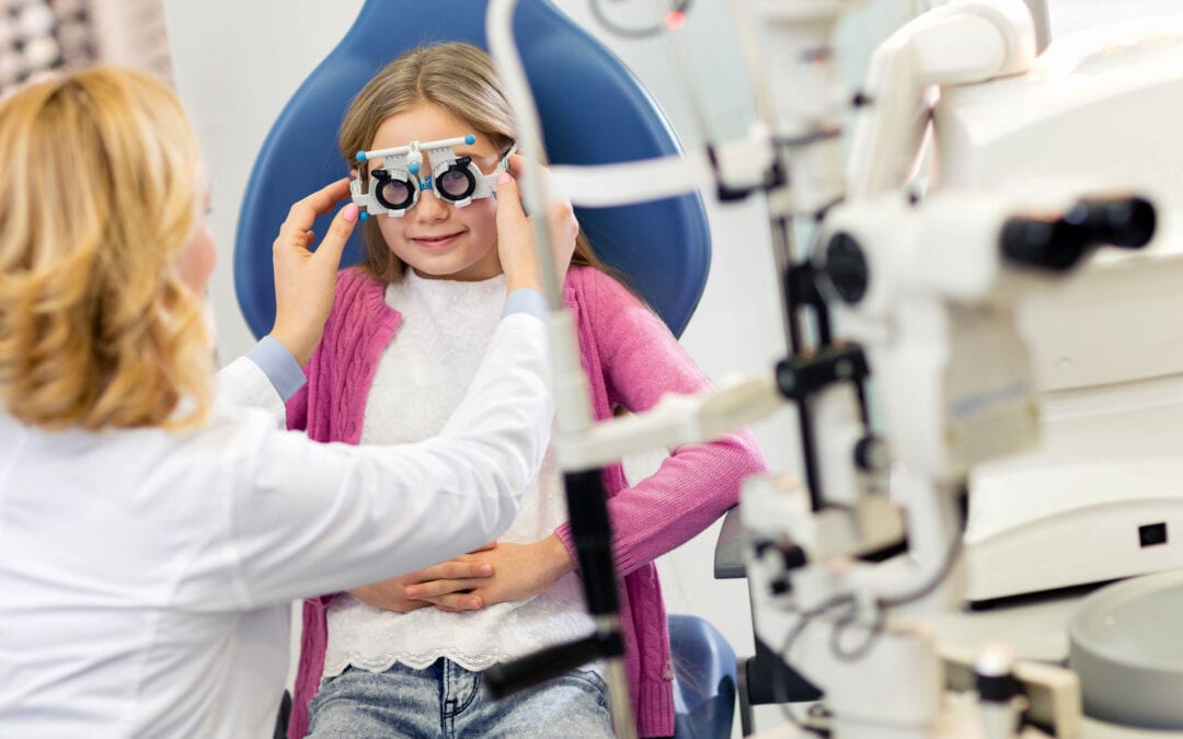 Girl at eye specialist controls vision